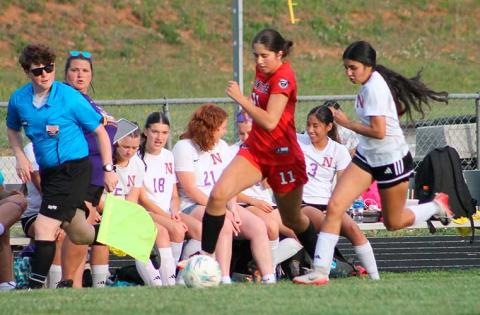 Channing Ray pushes upfield versus North Henderson April 29. (Press photo/Will Woolever)