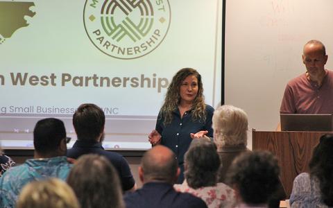 Press photo/Shelby Powell - Elissa Hashemi, director of Mountain West Partnership, speaks at the Eggs and Issues forum on support for small businesses.