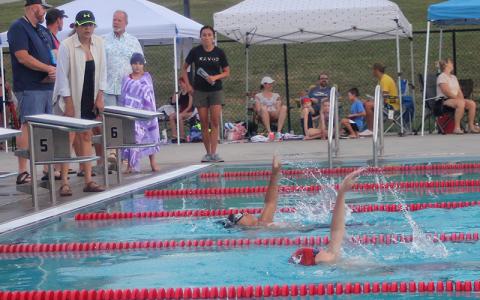 Knox Strum (foreground) and David Hernandez swim a close race in the boys 11-12 100-yard individual medley at the Macon County Rec Park July 2. (Press photo/Will Woolever)