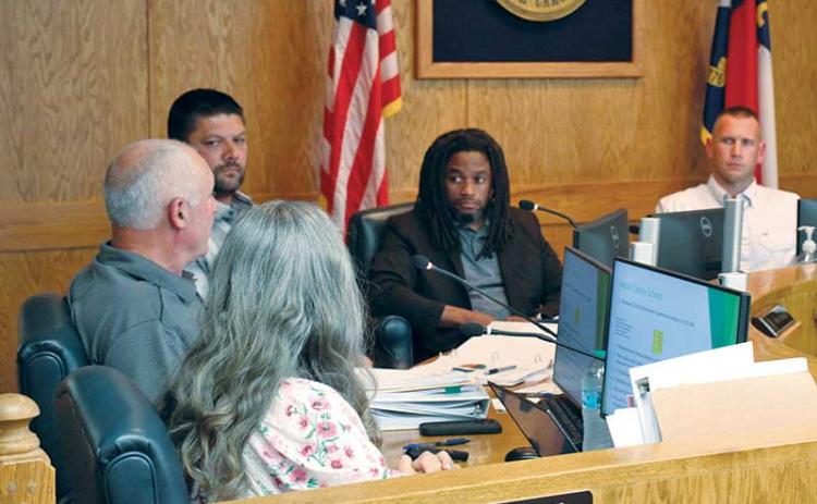 Press photo/Shelby Powell - County commissioners listen to the budget presentation at the May 12 meeting.