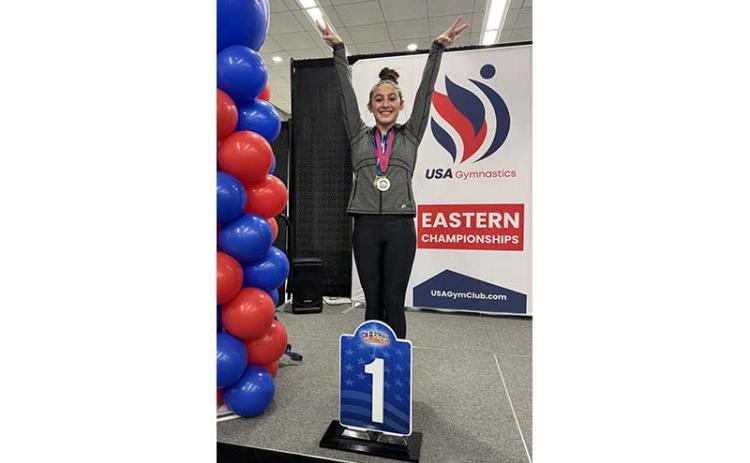 New Vision gymnast Giovanna Williams shows off her vault gold medal at the USA Gymnastics Level 9 Eastern Championships in Savannah, Georgia, earlier this month. (Photo submitted)