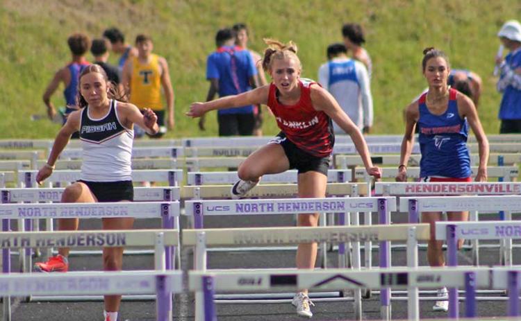 Anna Timan competes in the 100-meter hurdles at the Mountain Eight Conference Championships at North Henderson April 30. (Press file photo)