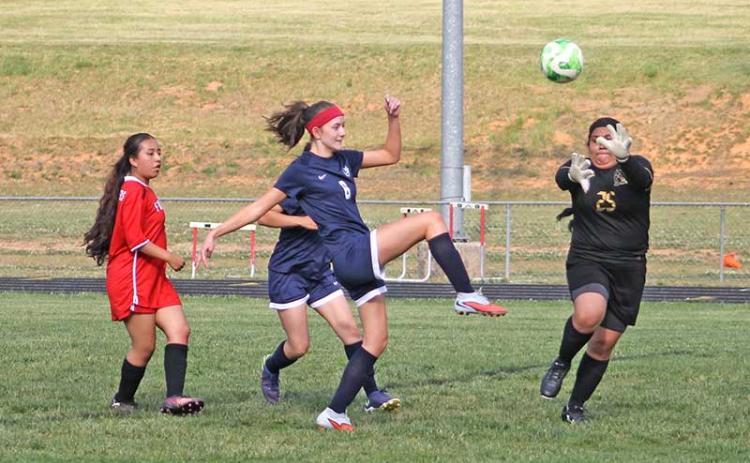 Fourth-year student Rachel Green scores one of her three goals in an exhibition match versus Franklin High School's JV team April 23. (Press photo/Will Woolever)