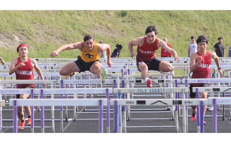 From left, Chad Engel, a Tuscola Mountaineer, Jonas Phillips and Ken Modlin compete in the 110-meter hurdles at the Mountain Eight Conference Championships at North Henderson April 30. (Press photo/Will Woolever)