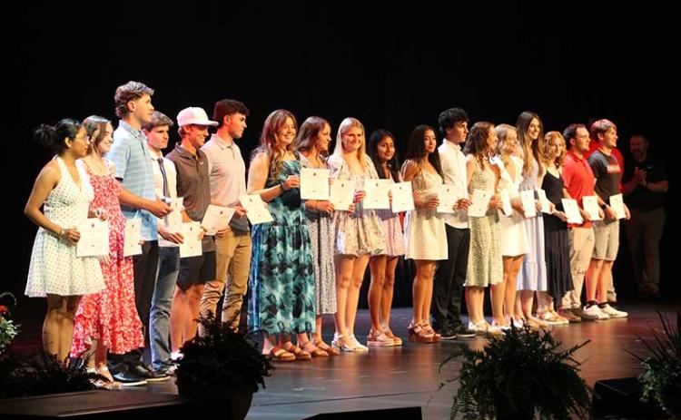 Franklin's senior scholar-athletes show off their plaques on stage at the school's annual Athletic Awards Ceremony May 28.