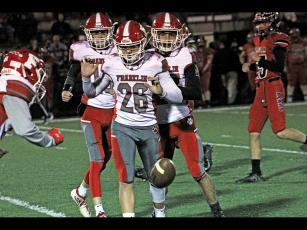 Press photo/Andy Scheidler A trio of Franklin players, including Ryan Craig (26), Devyn Blackburn (left) and Cameron Peek (right) make sure to let the ball continue rolling before touching it during Friday’s game in Canton. 