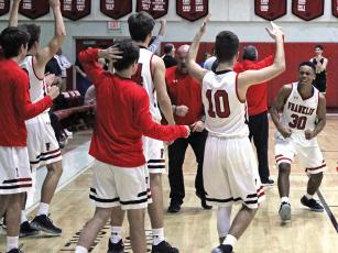 Press photo/Andy Scheidler Chad Wilson (30), Trey Woodard (10) and Franklin players and coaches celebrate moments after surviving to hold off Hayesville in Monday’s home game. The Panthers improved to 2-1 on the season.