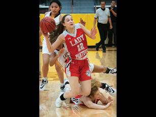 Press photo/Tom Pantaleo Franklin senior Chela Green goes to the floor after teammate Taylor Carlton and a Cherokee player collide. Green scored five points and grabbed six rebounds in the road victory. 