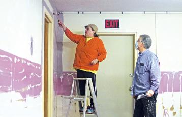 Press photo/Will Woolever -  Ann Marie McWhite and Doug Cross work on the Arise and Shine Thrift Store located in the Carson Community Center.