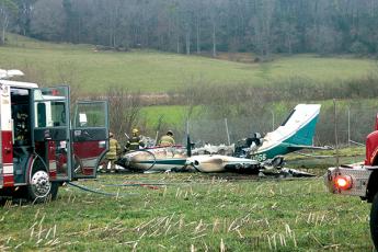 Press photo/ Will Woolever - A small twin-engine Cessna crashed at the Macon County Airport on Thursday afternoon. Emergency response units extinguished the fire and secured the scene. The pilot and two passangers were unharmed.