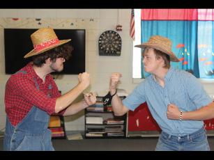 Press photo/Jake Browning - Franklin High School juniors Tyler Martin and Traveler Shaw rehearse for their play, a reimagining of the folktale of the Hatfields and McCoys.