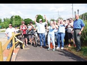 Press photos/Linda Mathias  - The Friends of the Greenway celebrate completion of the Greenway connector at a rally on June 12.