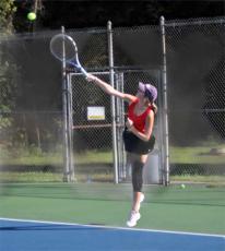 Press Photo/Will Woolever - Junior standout Alyssa Smith serves against Pisgah Sept. 27. Smith advanced to the second round of the 3A West Regional Singles Championship Oct. 22.