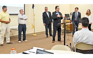 Press photo/Mia Overton - Sen. Kevin Corbin (center) speaks Monday at a meeting about expanding broadband access. Pictured with him are (from left) Rep. Mark Pless, Rep. Mike Clampitt, Rep. Karl Gillespie, Nate Denny and Angie Bailey.