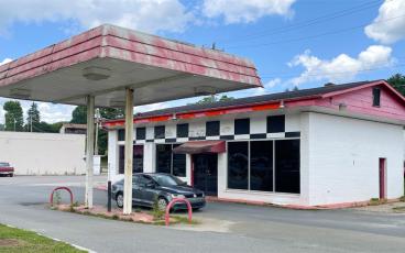 Press photo/Mia Overton The county will get the old Gulf gas station next to Town Bridge as part of a property exchange with the North Carolina Department of Transportation. The building could become the new home for the Friends of the Greenway.