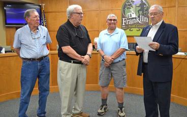 Press photo/Mia Overton - Franklin Mayor Jack Horton (right) presents a proclamation recognizing Sept. 4-10 as Help Homeless Veterans Week. Accepting the proclamation at the July Town Council meeting are (from left) Fred Frankland, Tom Fagg and Ned Kraft of the First Presbyterian Church Men’s Group.
