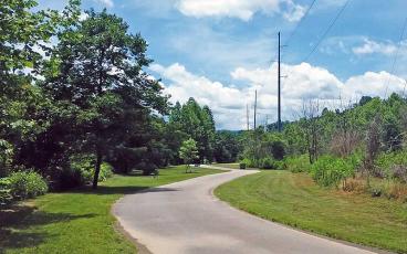 Press file photo - A scene along the Little Tennessee River Greenway. The town is buying a piece of property that could eventually connect the Greenway to the Macon County Recreation Park. The county has agreed to maintain and manage the area once it is complete.