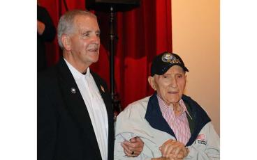 Press photo/Anissa Holland - World War II veteran Ray Welch (right) was recognized and presented several awards during the Veterans Day ceremony held Nov. 11 at the FHS Fine Arts Center. Pictured with Welch is County Commissioner and Vietnam veteran Gary Shields, who helped organize the event.