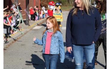 Press photos/Anissa Holland Willow Wright made her rounds at East Franklin as the student body cheered her on before she traveled to the cancer center in Asheville to begin treatment.
