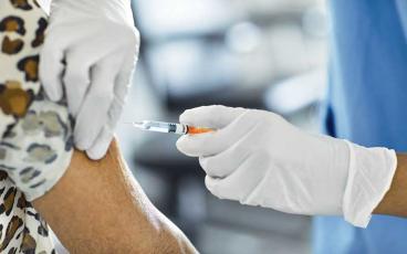Public Health officials recommend getting the flu vaccine to protect yourself. In addition to the vaccine, you can help prevent spreading the flu and other illness by avoiding close contact with sick people, avoiding touching your eyes, nose, and mouth, covering your coughs and sneezes, and washing your hands frequently with soap and water.