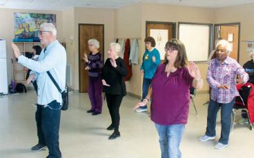 Press photo/Thomas Sherrill - Seniors participate in a tai chi class at the Crawford Senior Center.