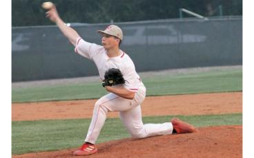 Press photo/Will Woolever Junior Jayden “Knuckles” Rogers pitches versus North Henderson at McConnell Field April 11. 
