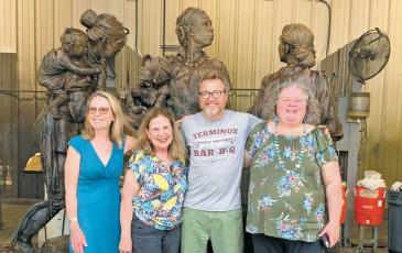 Photo submitted - The “Sowing the Seeds of the Future” statue depicts three women and two children from different backgrounds who all lived and worked on a settlement on the banks of the Little Tennessee River in what is now Franklin. Pictured at the foundry with the statue are Women’s History Trail team members Mary Polanski, Marty Greeble, sculptor Wesley Wofford, and Claire Suminski.