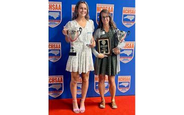 Photo courtesy of Blair King - Multi-sport standout Tori Ensley (left) and head cross country/women’s track and field coach Melissa Ward are pictured at right with their awards following the North Carolina High School Athletic Association’s annual Awards Ceremony in Greensboro June 14.