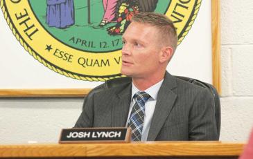 Press photo/Thomas Sherrill - New Macon County Schools Superintendent Josh Lynch speaks during the Monday, July 24, school board meeting. This meeting was Lynch’s first since starting the job July 1.