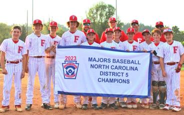 Photo courtesy of Jessica Cantrell - The Franklin Little League 12U Majors are pictured with their District 5 Championship banner June 27 at Parker Meadows. From left to right are Lawson Gibson, Max Cable, Corbin Chastain, Graham Cantrell, Easton Holbrooks, Paxton Green, Jude Morgan, Cam English, Sam Moore, Cooper Jones and Nolan Estes. Coaches: Josh Cantrell, Tim Holbrooks, Nick Morgan, Chad Stockton.