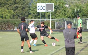 Press photo/Will Woolever - Senior defender Jaydon Pevia battles for possession in a recent match at the Panther Pit.