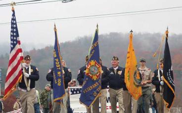 Press photo/Thomas Sherrill - The American Legion and VFW Color Guard lead the Veterans Day parade.