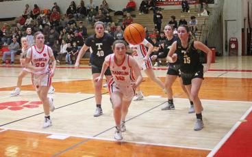 Press photo/Will Woolever - Sophomore guard Layla Reeves chases a loose ball versus Tuscola on Tom Raby Court Dec. 19. 