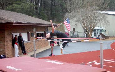 Press photo/Will Woolever - Junior Adam Rogers competes in the high jump at Swain Jan. 24. 