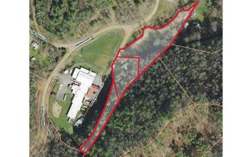 Map/Macon County GIS - Macon County will buy three tracts of land (outlined in red) adjacent to the Nantahala School property to build a septic system for the school. The school’s current septic system has been failing for years.