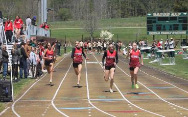 Press photo/Will Woolever - Four of Franklin’s deep stable of freshmen girls compete in the 100-meter dash at Rabun Gap April 13. Pictured are Bailey Callahan, Kamden Reis, Audrey Pressley and Anna Timan.