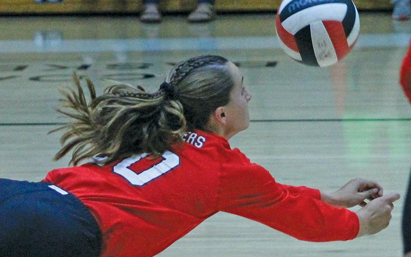 Press photo/Andy Scheidler Sophomore Kendall Reis dives for a dig during junior varsity action Sept. 26 against Hendersonville.  The Panthers went 20-1 this season, suffering a lone loss to conference foe Brevard. 