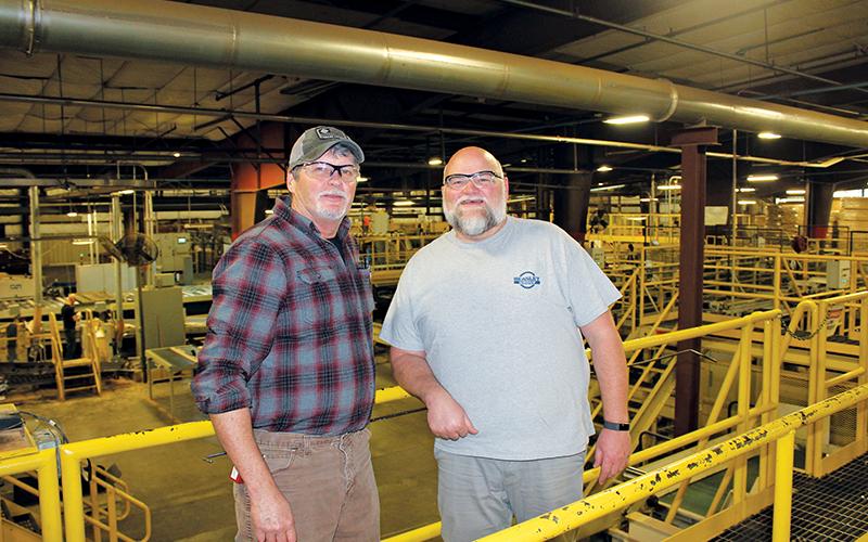 Press photo/Lee Buchanan Beasley Flooring plant manager Chris Norton, left, and production manager Richard Burch are shown in the Franklin facility.