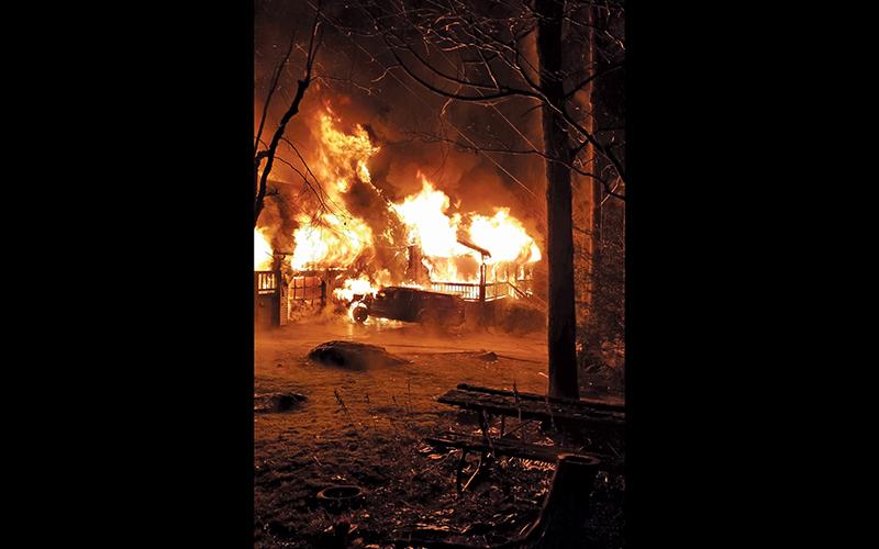 Photo submitted Firefighters arrived on the scene to find the house fully engulfed in flames.