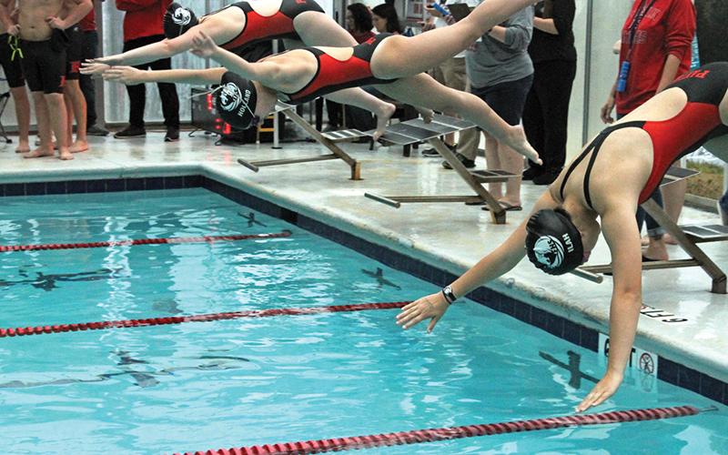 Andy Scheidler sports@thefranklinpress.com Two relay teams nailed regional-qualifying times in Franklin’s first swim meet of the season.  The girls 200-yard medley relay kicked things off Nov. 23 at Franklin Health & Fitness. Ilah Williams, Claire Holland, Deaven Lombard and Callie Roper combined to win the event with a time of 2 minutes, 11 seconds. It was 1.99 seconds under the threshold to qualify for regional.  Later in the meet, the boys 200 freestyle relay won their event and landed a regional berth. 