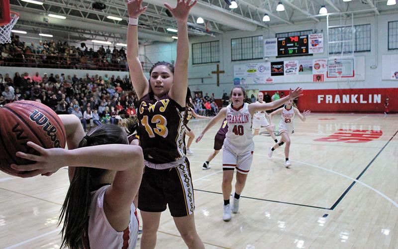 Press photo/Andy Scheidler - Franklin junior Nevaeh Tran prepares to make an inbounds pass, looking for Makayla Brewer (40) and Sierra Wade (23) while being defended by Cherokee’s Deante Toineeta during action Friday, Jan. 3. 