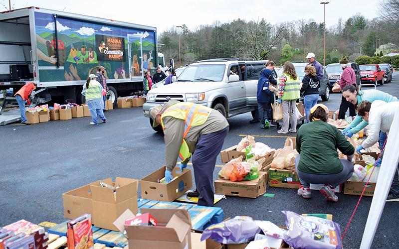 Press photo/Linda Mathias - MANNA’s mobile food bank ran out of food on March 23 due to high demand.