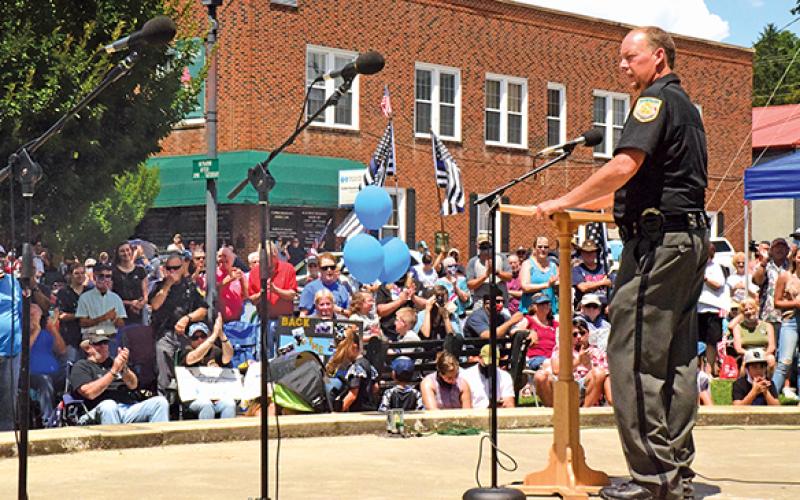 Press photo/Linda Mathias - Macon County Sheriff Robert Holland addresses the crowd that packed town square for the Back the Blue event.