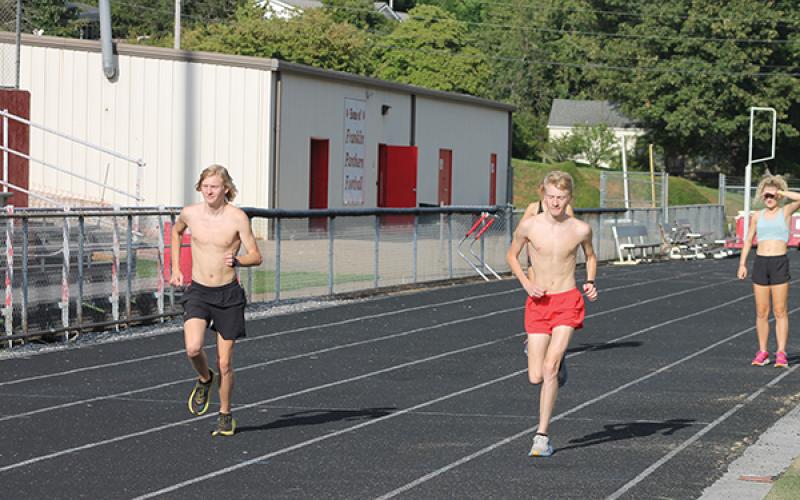 Press photo/Will Woolever - FHS seniors Ethan and Nathan Stamey run during a recent cross country practice.