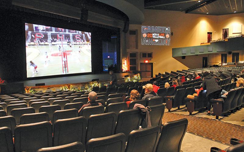Press Photo/Will Woolever - Panther volleyball fans watch a recent game on the big screen at the Smoky Montain Center for the Performing Arts. The theater has been showing live broadcasts of FHS games for fans unable to attend.