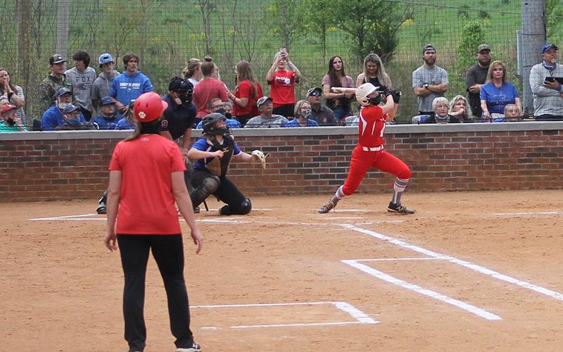 Press Photo/Will Woolever - Sophomore third baseman Tori Ensley knocks a 2-run homer against Smoky Mountain April 13. Ensley has compiled a .483 batting average on the season with 14 hits and 10 RBI’s. 