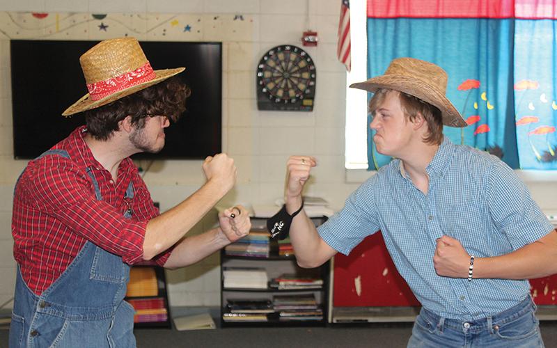 Press photo/Jake Browning - Franklin High School juniors Tyler Martin and Traveler Shaw rehearse for their play, a reimagining of the folktale of the Hatfields and McCoys.