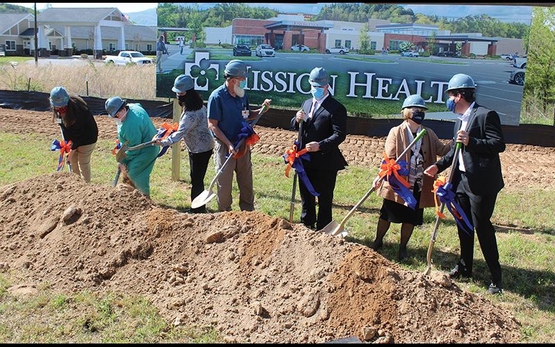 Press photo/Jake Browning - HCA officials turn up the first dirt at the future site of Angel Medical Center at One Center Court. From Left: Becky Dahl, Peggy Ramey, Leslie Vanhook, David Franks, Tim Layman, Karen Gorby, Johnny Mira-Knippel.