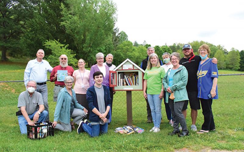 Read2Me held a dedication for the newest Little Free Library on May 18 at Macon Middle School. The library was dedicated in honor of long-time educator Clayton Ramsey. Pictured are members of Friends of the Library, Rotary of Franklin, Macon County Library staff, Clayton Ramsey’s family, Read2Me and Macon Middle School. (Front, from left) Lenny Jordan, Sally Dyar, Matthew Vargas, Laura Vargas and Janet Greene; (back row) Mike White, Tom James, Karen Wallace, Sharon and Jeff Gillette, Bill Swift, Debbie Tall