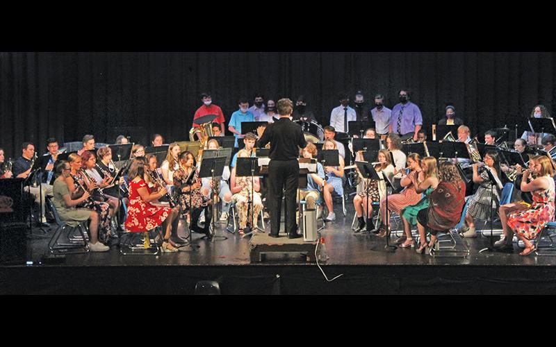 Press photo/Jake Browning - The Franklin High School symphonic band, led here by student director Zack Brown of Western Carolina University, performed its first concert in 16 months on Monday night..